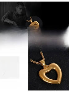 Detailed close-up of a 316L stainless steel gold heart pendant on a twisted rope chain