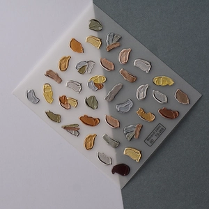 Macro view of Morandi paint 5D embossed nail stickers with textured metallic brushstrokes