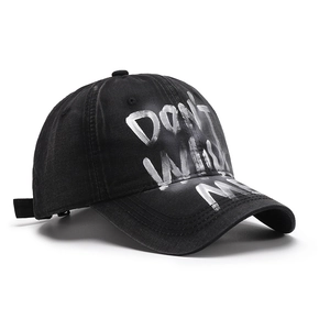 Black washed cotton baseball cap with white graffiti text and adjustable strap for unisex