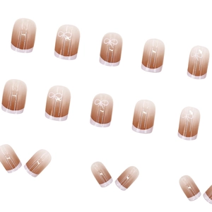 Short square gradient press-on nails with white French tips and bow knot designs