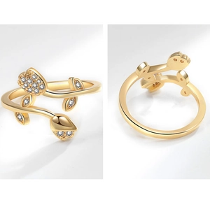 Macro detail of tulip flower ring with pavé cubic zirconia on golden leafy band