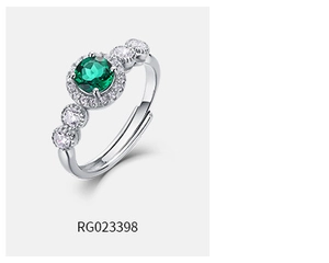 Macro shot of S925 silver ring featuring emerald gemstone with halo setting detail