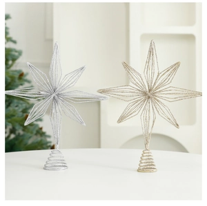 Close-up of gold and silver hollow star tree toppers with sparkling glitter finish