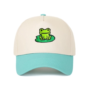 Two-tone trucker hat with embroidered frog on lotus leaf in cream and mint green