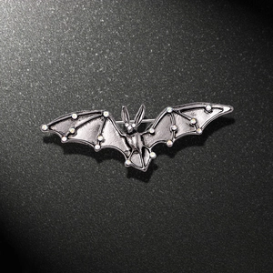 Gothic bat brooch in gunmetal finish with sparkling iridescent AB rhinestones
