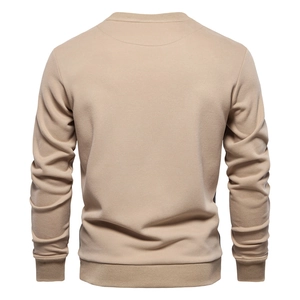 Back view of a casual beige crewneck sweatshirt showing ribbed cuffs and hem details