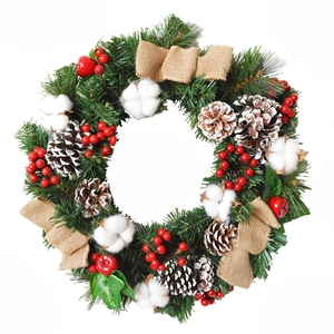 Classic Christmas wreath with pine needles, red berries, cotton balls and pinecones on white