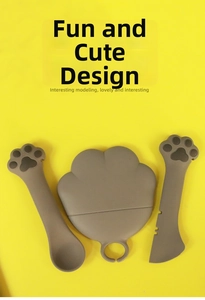 Flat lay of brown cat-paw shaped canned food spoons on a bright yellow background