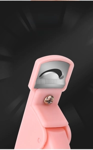 Macro shot of sharp curved stainless steel blade on pink acrylic nail tip clipper
