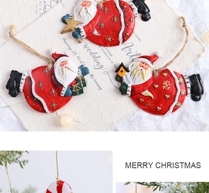 Detailed view of resin Santa Claus ornaments and candy canes with vintage twine ropes