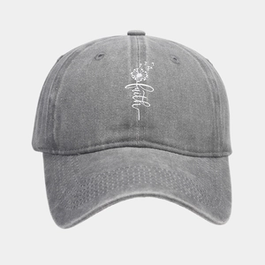 Detail view of washed cotton baseball cap with faith dandelion print in dark grey finish