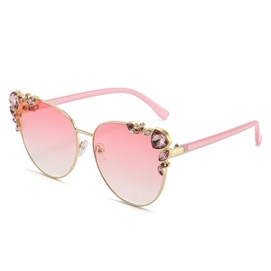 Fashionable oversized metal cat-eye sunglasses with rhinestone accents and pink gradient lenses