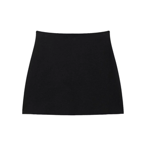 Macro shot of the black jacquard knit texture on the elegant mini skirt garment