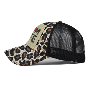 Leopard print mesh ponytail baseball cap with MOM LIFE patch on a white background