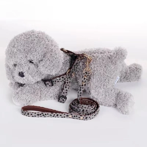 Detail of adjustable leopard print pet harness and leash set on a plush dog model