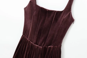 Close-up of wine red velvet corset dress showing premium fabric texture and sewing detail