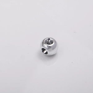 Macro shot of 8mm silver plated 4-way spacer bead for DIY jewelry making and phone chains