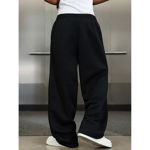 Detailed back view of black loose fit joggers showing modern cut and soft fabric