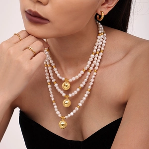 Three-layer natural pearl necklace with 18k gold plated beads and spherical pendants