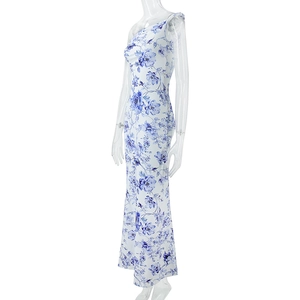 Detail view of floral print maxi dress featuring blue flower patterns and slim fit cut