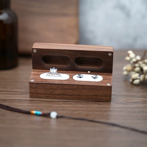 Elegant black walnut wood jewelry box with velvet lining for rings and stud earrings
