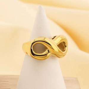 Minimalist 18k gold plated stainless steel infinity symbol ring on a white display stand