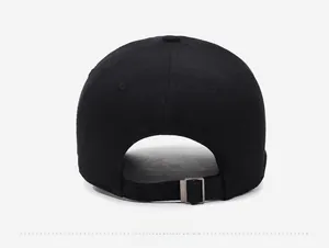 Close-up of the black cotton baseball cap showing the adjustable metal buckle at the back