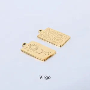 Detail of gold-plated stainless steel Virgo pendant with sun and moon celestial engraving