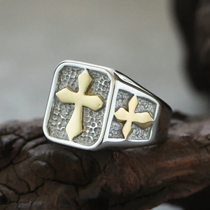 Detailed macro view of vintage cross ring with silver finish and hammered texture