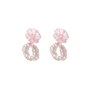 Pink flower and pearl drop earrings with crystal beads on a white background