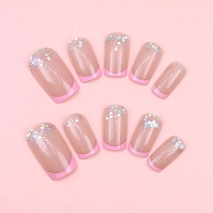 Barbie pink crescent glitter press-on nails with French tip design and silver sequins