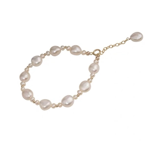 Baroque pearl bracelet with 14K gold-filled beads and adjustable chain on white background