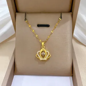 Titanium steel gold crown necklace with shimmering cubic zirconia in jewelry box