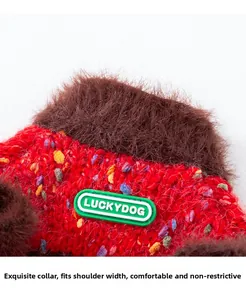 Macro shot of pet knit sweater showing colorful dots on red fabric and plush collar detail
