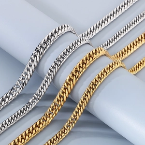 Detail shot of four gold and silver Cuban chain bracelets in durable stainless steel