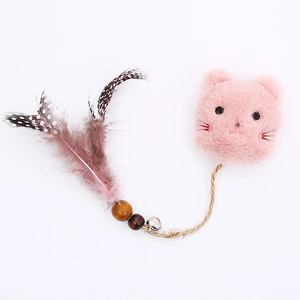 Pink plush cat toy with feathers, wooden beads and small bell on a white background