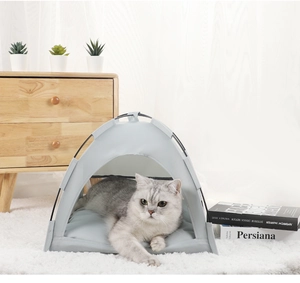 Cozy light gray pet tent with plush white cushion set in a modern minimalist room