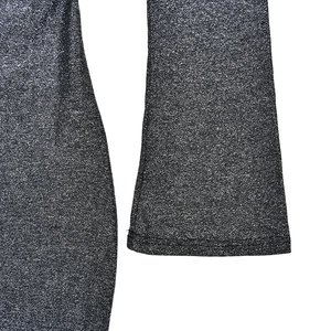 Detail of grey knitted fabric with silver glitter finish and sleeve cuff texture
