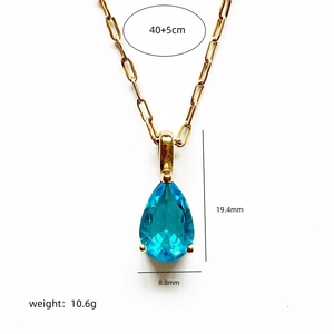 Gold paperclip chain necklace with blue teardrop gemstone and product dimensions