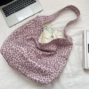 Detail view of pink leopard tote bag interior showing the zippered pocket and large capacity