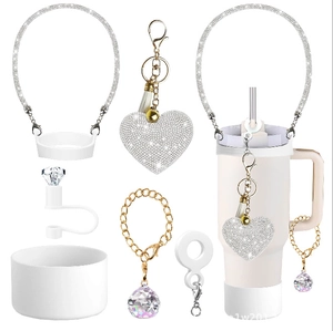 Close-up of silicone water bottle accessories set with sparkling rhinestones and heart charm