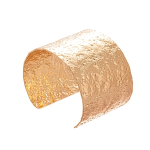 Polished gold hammered metal cuff bracelet with elegant textured finish for women