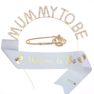 Detail of Mummy to Be baby shower kit including gold rhinestone headband and sash