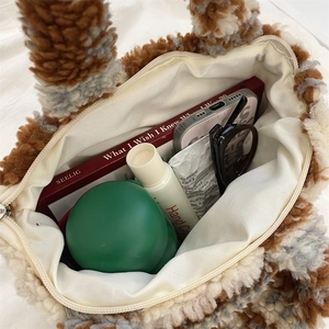 Top macro view of plush sherpa tote bag interior showing ample storage for daily essentials