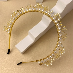 Handmade headband with gold wire weaving featuring white pearls and clear crystals