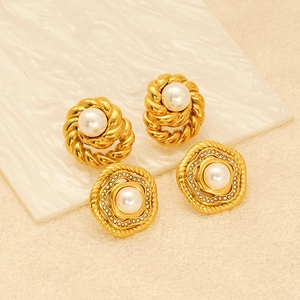 Detailed view of pearl earrings with twisted gold ropes and sparkling diamond accents