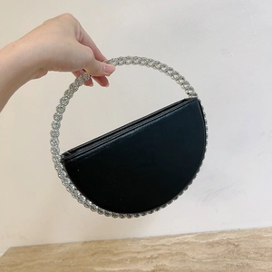 Elegant black evening clutch with sparkling rhinestone ring handle and semi-circle design