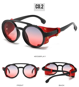 Detail view of steampunk round sunglasses with black frames and red leather side shields