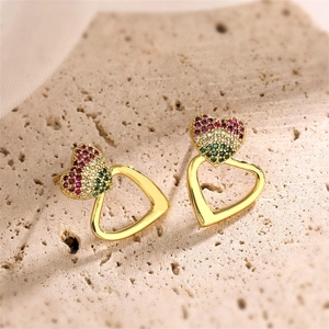 Detail of heart stud earrings with colorful pavé crystals and gold hollow heart frames