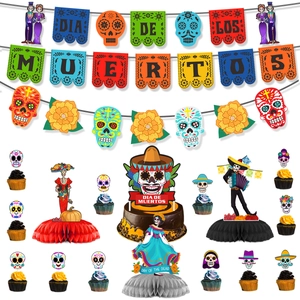 Dia de los Muertos party set with banners, honeycomb centerpieces and skull cupcake toppers